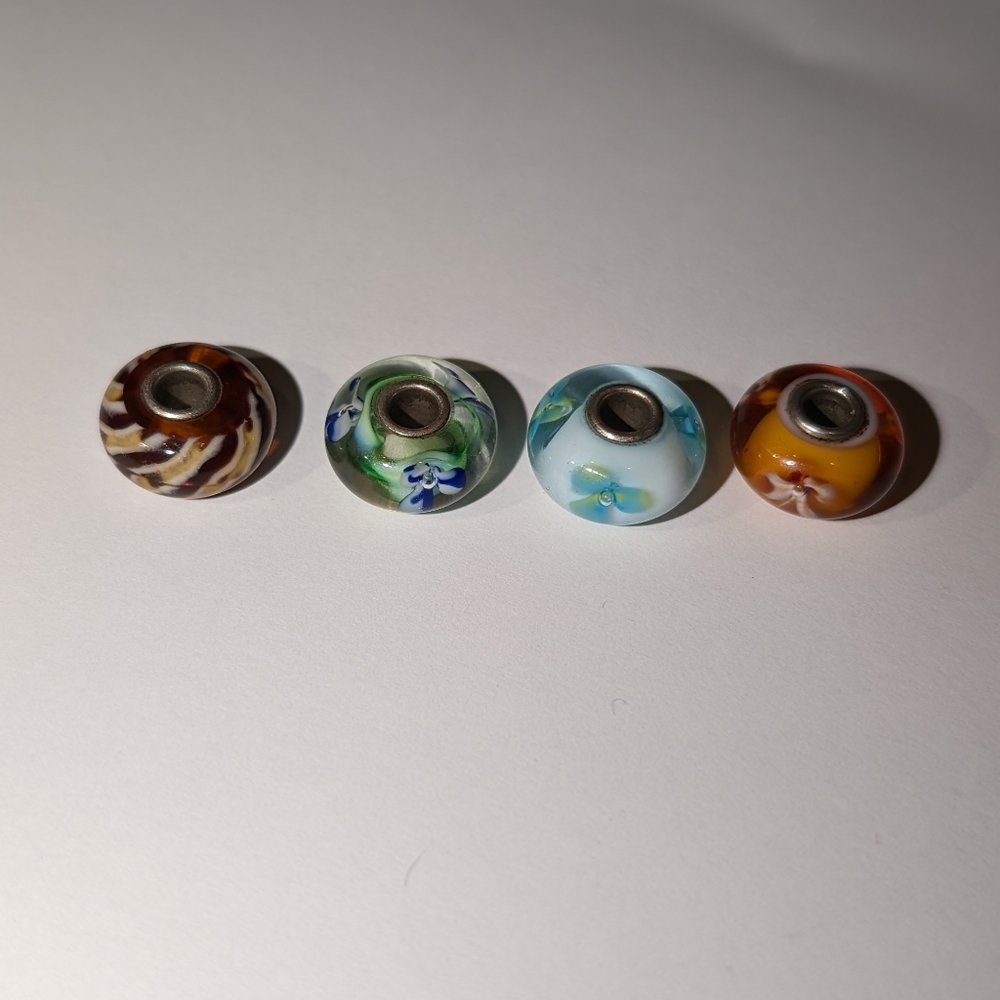 Four glass trollbeads